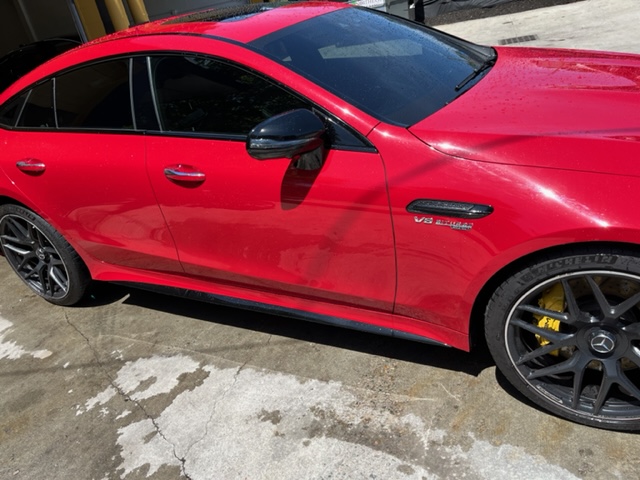 Glossy red car with ceramic coating and paint protection at 2Shady Tinting
